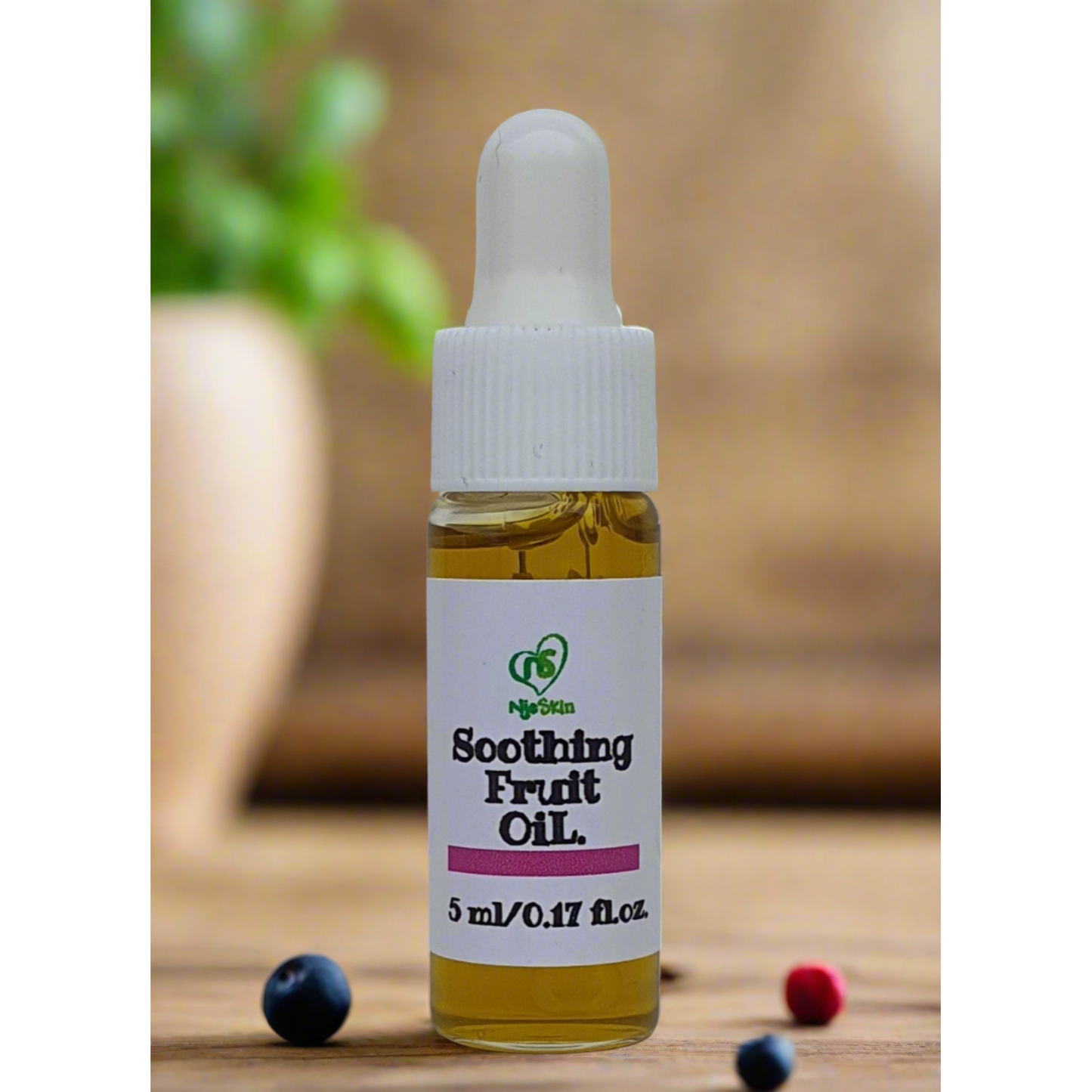 5ml natural face oil in a glass dropper bottle with a few berries on the side.