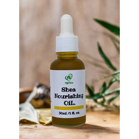 A bottle of Shea Nourishing Oil with a dropper, labeled with the brand Njeskin and the product name clearly visible.